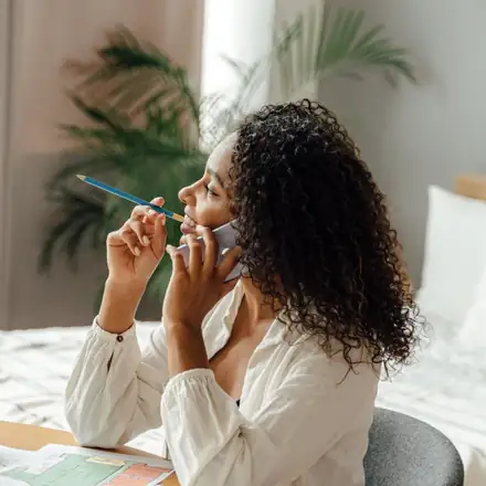 A woman on a call at her laptop