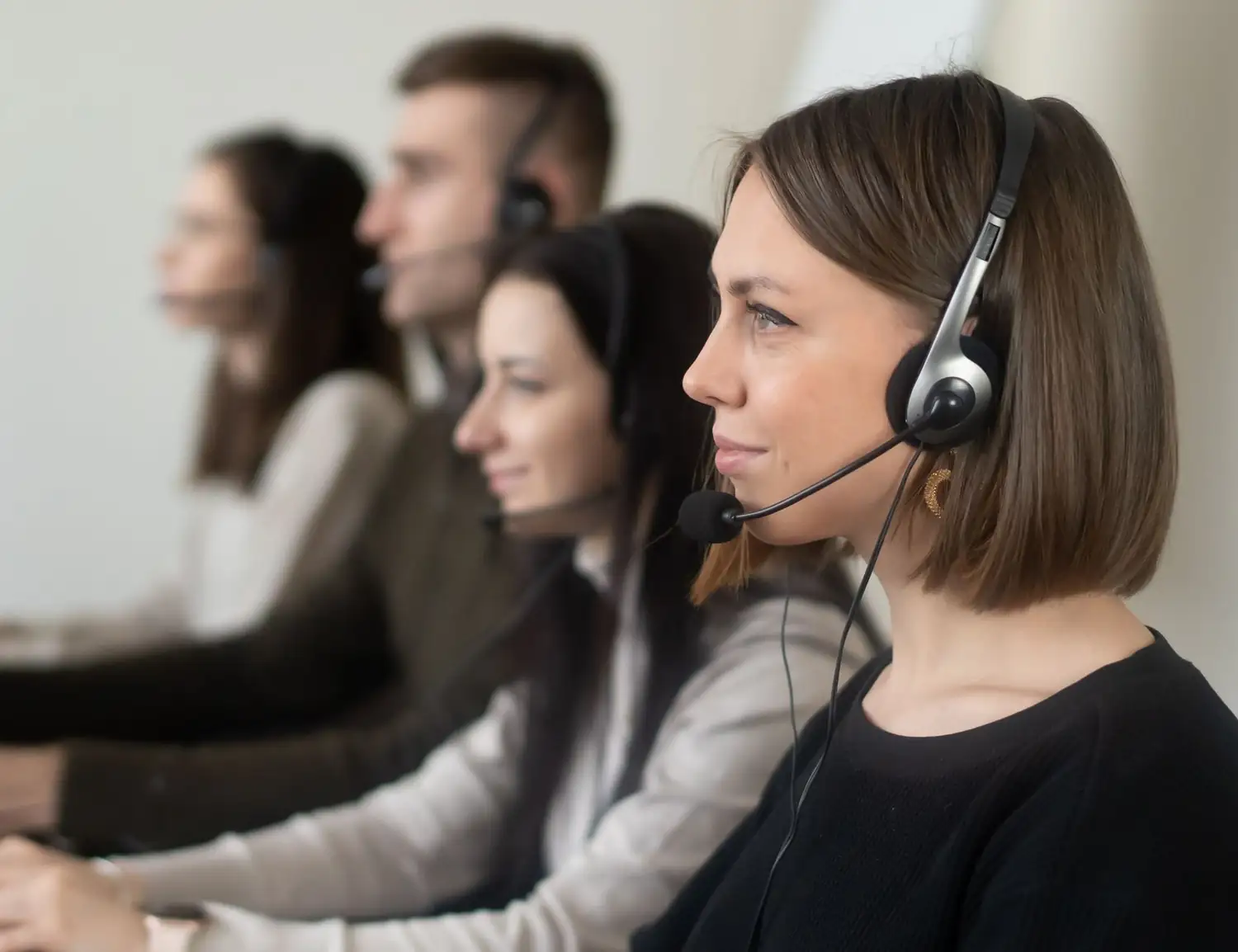 A billing team on payer calls at their desks