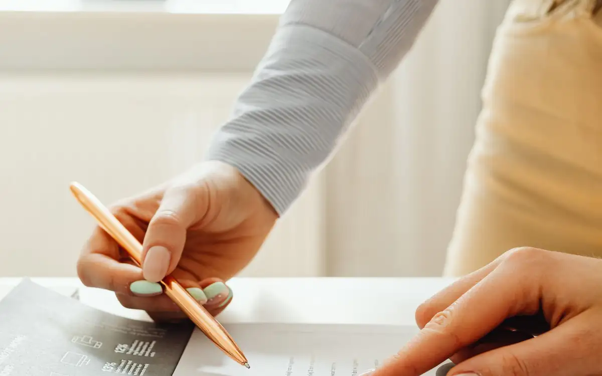 A pen tracing a chart on a printed report